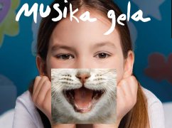 Collage de una niña con una boca de gato sonriendo. Arriba titulo: Musika gela